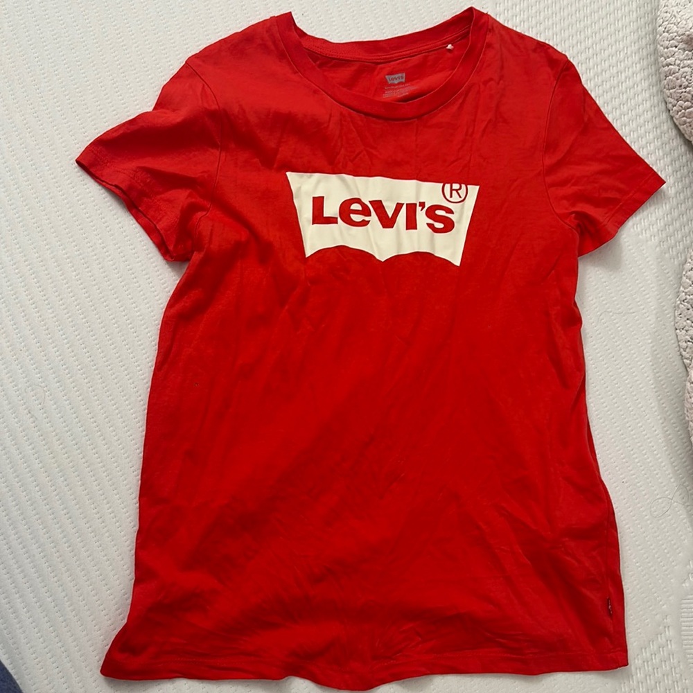 Red levis. Never worn but without tags.